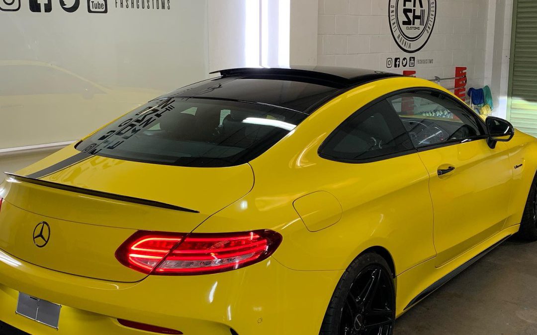 Mercedes C63 wrapped in Oracal Yellow with Edition One stripe